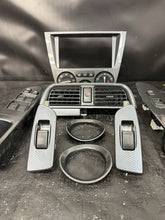 Load image into Gallery viewer, 2004 Subaru WRX STI SPT Carbon Fiber Interior Trim Bezel Set OEM INCOMPLETE