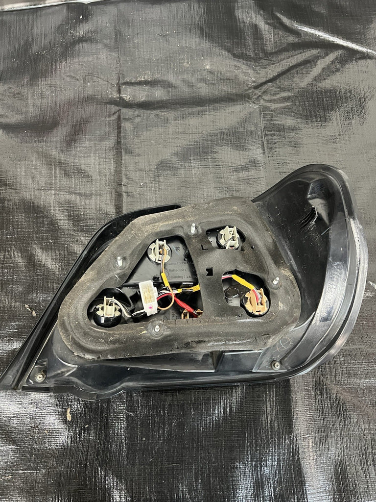 2004-2007 Subaru Impreza WRX STi Tail Light Drivers Side Sedan Genuine #500989